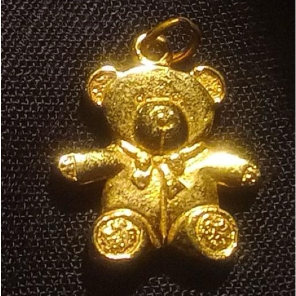 Gold Toned bear pendant and gold toned earrings!